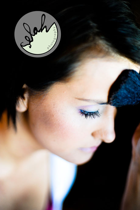 bride putting on makeup