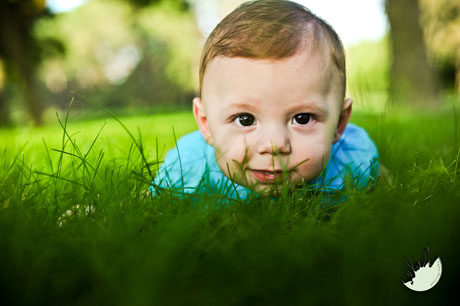 baby laying in the grass