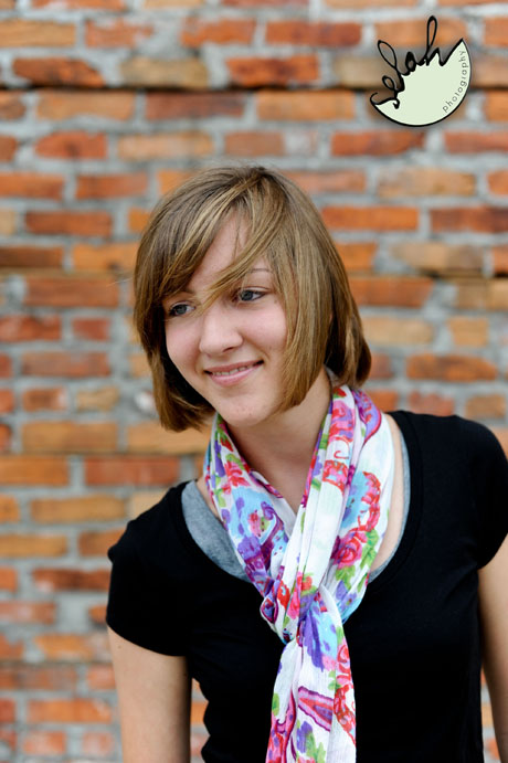 girl wearing a pink scarf in photo